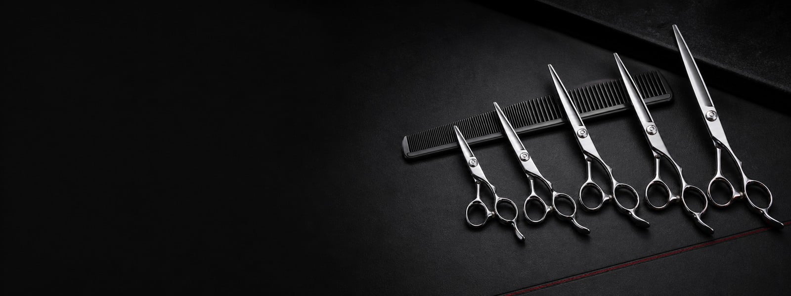 Wide showcase of barber shears from 5.5 inch to 8.5 inch blade lengths for cutting technique selection