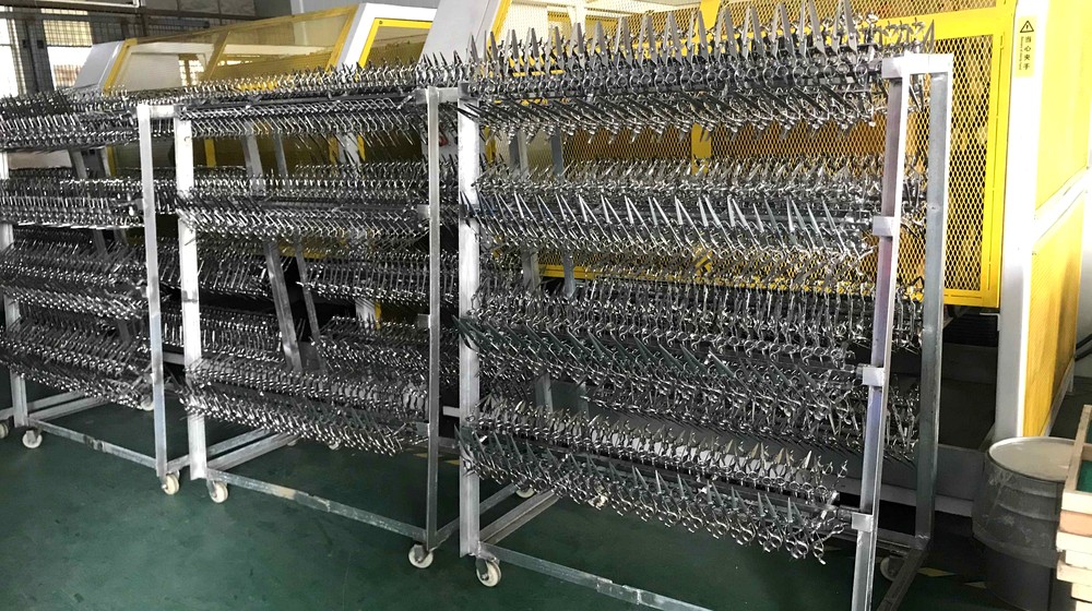 Polished grooming shears staged on factory racks for salon fleet orders